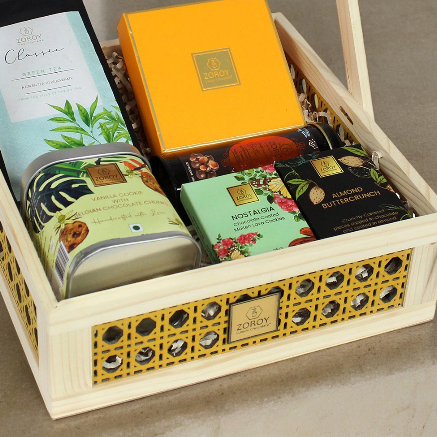 ZOROY Rakhi Special Wooden cane hamper with chocolates, green tea, cookies and coated nuts